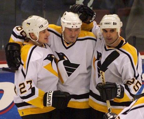 Kevin Stevens (right), a Pembroke native, played 10 seasons with the Penguins and also had a stint with the Bruins.
